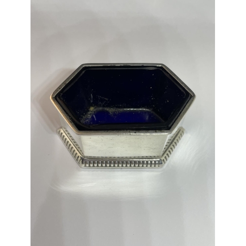 91 - A CHESTER HALLMARKED WALKER AND HALL HEXAGONAL SALT WITH BLUE GLASS LINER