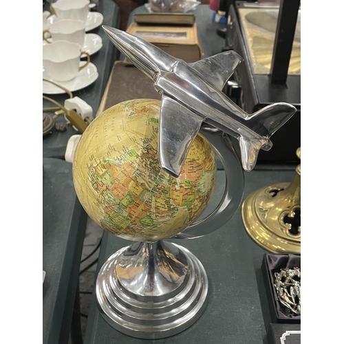 128 - AN ART DECO CHROME JET ON A GLOBE PEDESTAL