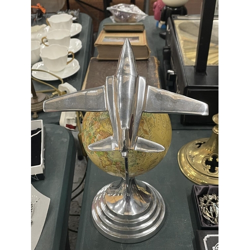 128 - AN ART DECO CHROME JET ON A GLOBE PEDESTAL