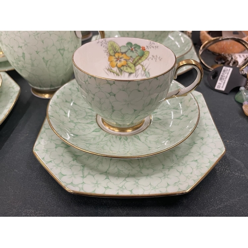 130 - A VINTAGE PARAGON TEASET TO INCLUDE A CAKE PLATE, CREAM JUG, SUGAR BOWL, CUPS SAUCERS AND SIDE PLATE... 