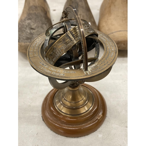 162 - THREE MINIATURE BRASS CLOCKS, HEIGHT APPROX 6CM, PLUS A SMALL ARMILLARY SPHERE ON A WOODEN BASE, HEI... 