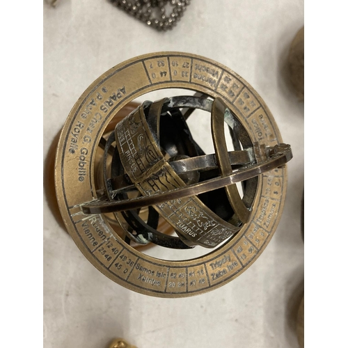 162 - THREE MINIATURE BRASS CLOCKS, HEIGHT APPROX 6CM, PLUS A SMALL ARMILLARY SPHERE ON A WOODEN BASE, HEI... 