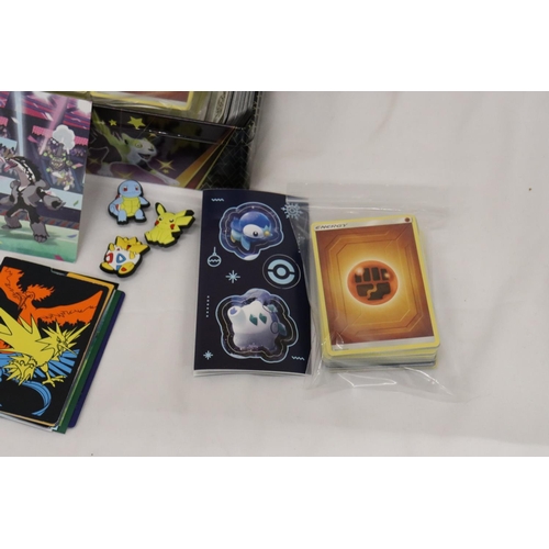 195 - A POKEMON COLLECTORS TIN FULL OF CARDS, DIVIDERS AND EXTRAS