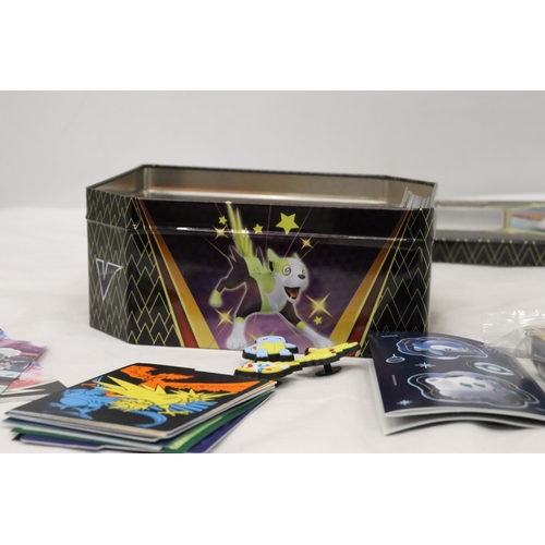 195 - A POKEMON COLLECTORS TIN FULL OF CARDS, DIVIDERS AND EXTRAS