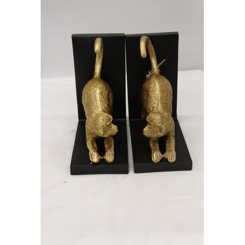 200 - A PAIR OF GOLD COLOURED RESIN MONKEY, BOOK-ENDS, HEIGHT 19CM