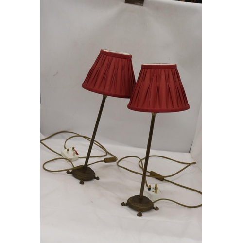 209 - A PAIR OF LAMPS WITH PLEATED SHADES AND BRASS STANDS