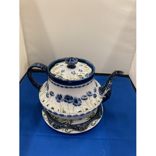 21 - A MOORCROFT POTTERY MACINTYRE & CO BLUE POPPY FLORIN WARE TEAPOT ON STAND