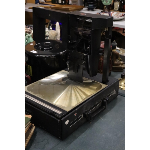 214 - A PORTABLE OVERHEAD PROJECTOR WITH HARD CASE 3M