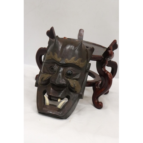 218 - A LARGE WOODEN CHINESE CARVED PEDESTAL TOGETHER WITH A VINTAGE WOODEN MASK