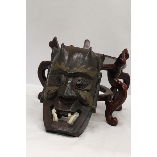 218 - A LARGE WOODEN CHINESE CARVED PEDESTAL TOGETHER WITH A VINTAGE WOODEN MASK