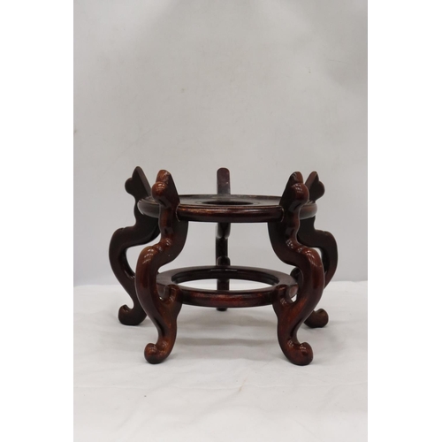 218 - A LARGE WOODEN CHINESE CARVED PEDESTAL TOGETHER WITH A VINTAGE WOODEN MASK