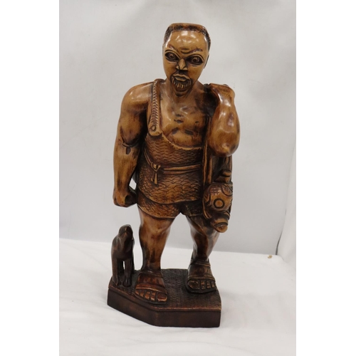 235 - A LARGE HAND CARVED WOODEN HUNTER GATHERER