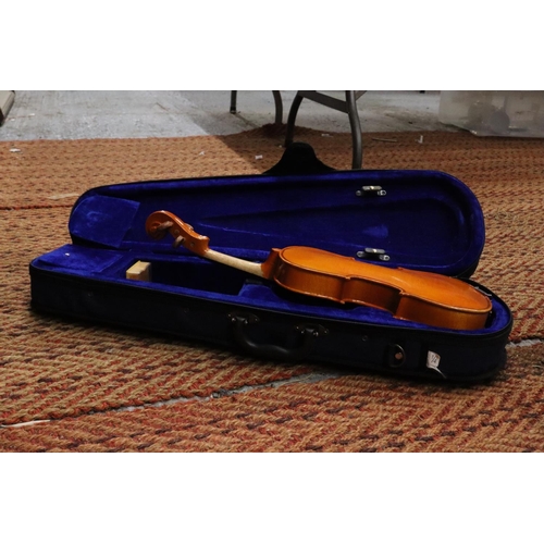 248 - A STENTOR STUDENT 1/4 VIOLIN IN A CASE