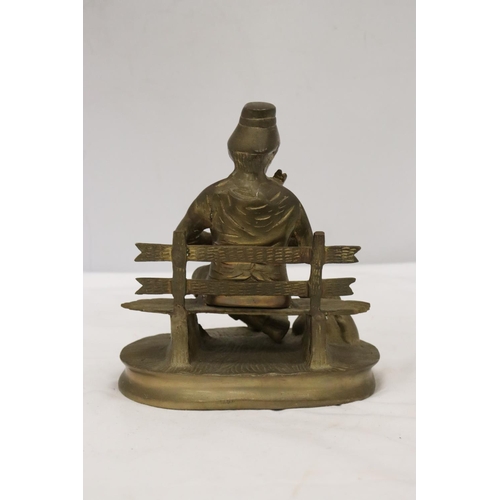 295 - A BRASS SEATED MUSICIAN