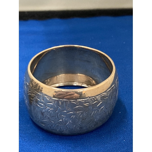 31 - THREE SILVER ITEMS TO INCLUDE TWO HALLMARKED BIRMINGHAM NAPKIN RINGS GROSS WEIGHT 59.67 GRAMS