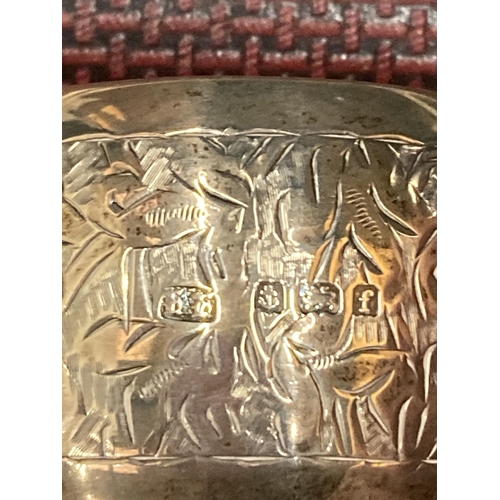 31 - THREE SILVER ITEMS TO INCLUDE TWO HALLMARKED BIRMINGHAM NAPKIN RINGS GROSS WEIGHT 59.67 GRAMS