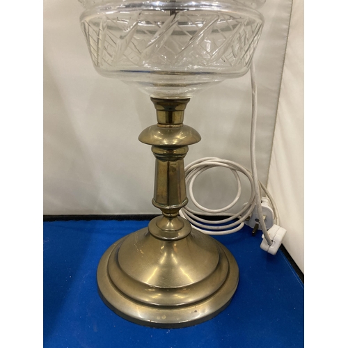 45 - A 19TH CENTURY OIL LAMP CONVERTED TO ELECTRIC WITH A BRASS BASE, CLEAR CUT GLASS RESERVOIR, MILK GLA... 