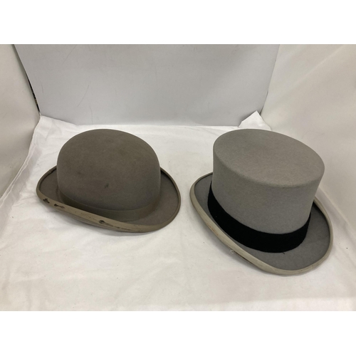 73 - TWO GREY VINTAGE HATS TO INCLUDE A BOWLER DUNN & CO AND A TOP HAT