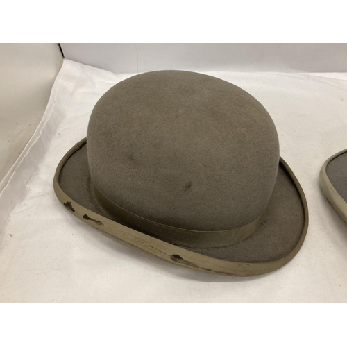 73 - TWO GREY VINTAGE HATS TO INCLUDE A BOWLER DUNN & CO AND A TOP HAT