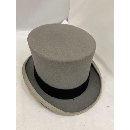 73 - TWO GREY VINTAGE HATS TO INCLUDE A BOWLER DUNN & CO AND A TOP HAT