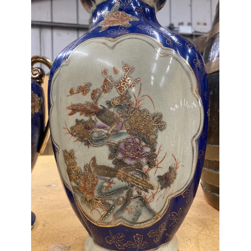 86 - THREE LARGE DECORATIVE ORIENTAL PIECES TO INCLUDE TWO VASE AND A TWIN HANDLED LIDDED URN