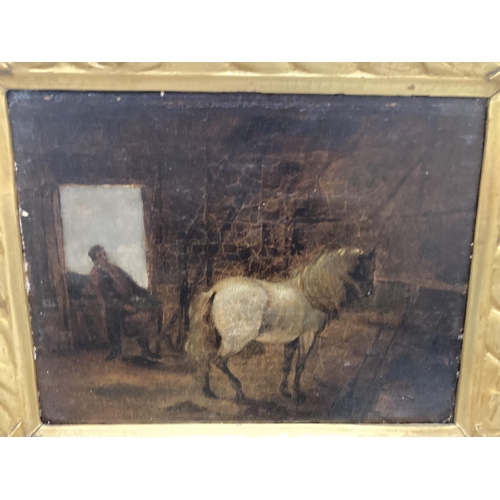 89 - A GILT FRAMED OIL ON BOARD OF A HORSE IN A STABLE