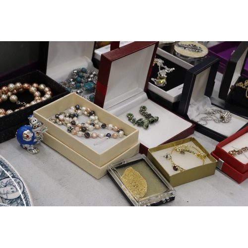 301 - A LARGE QUANTITY OF COSTUME JEWELLERY AND ENAMEL TRINKET B0XES