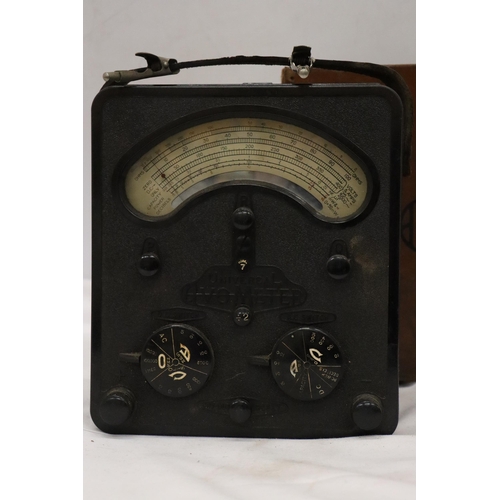 306 - A LARGE BAKELITE AVOMETER IN LEATHER CASE