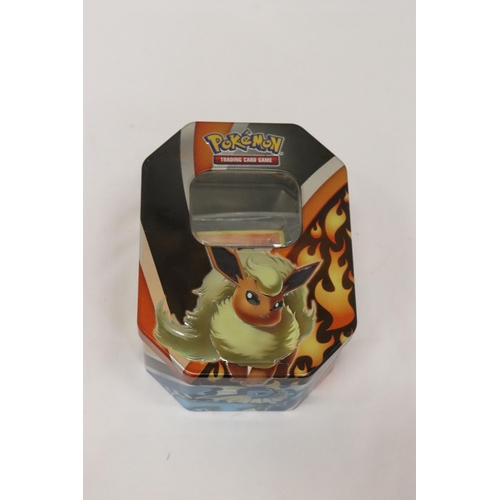 317 - A POKEMON COLLECTORS TIN FULL OF 100+ POKEMON CARDS