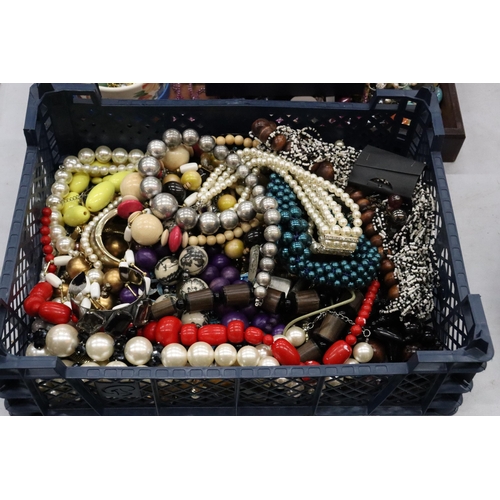 321 - A LARGE QUANTITY OF COSTUME JEWELLERY TO INCLUDE AMBER STYLE BEADS, BANGLES, NECKLACES, BEADS, ETC, ... 