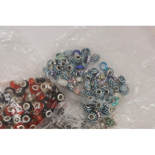 322 - A LARGE QUANTITY OF PANDORA STYLE BEADS, SOME MARKED 925