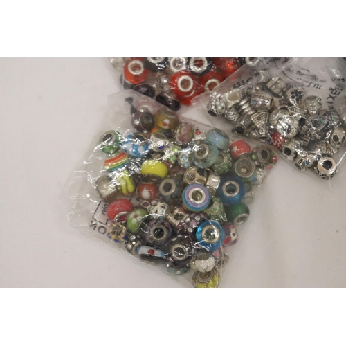 322 - A LARGE QUANTITY OF PANDORA STYLE BEADS, SOME MARKED 925