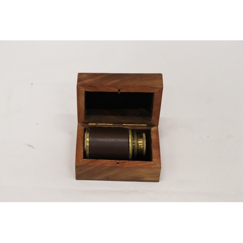 340 - A BOXED BRASS AND LEATHER TELESCOPE