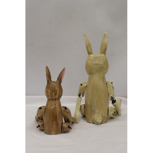 356 - TWO WOODEN SHELF RABBITS