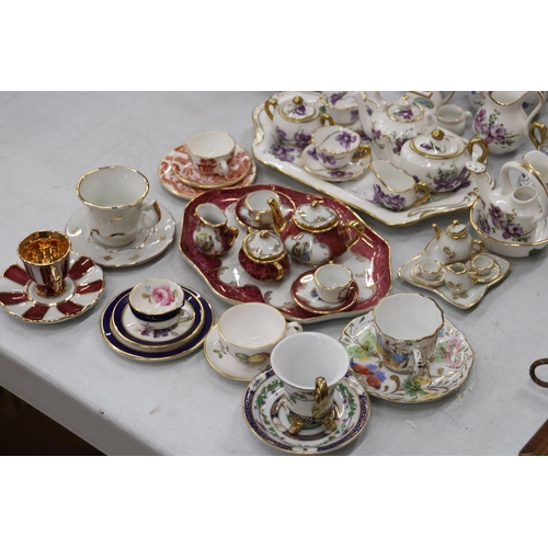 358 - A LARGE COLLECTION OF MINIATURE CHINA AND POTTERY TO INCLUDE LIMOGES AND HAMMERSLEY TEASETS ON TRAYS... 