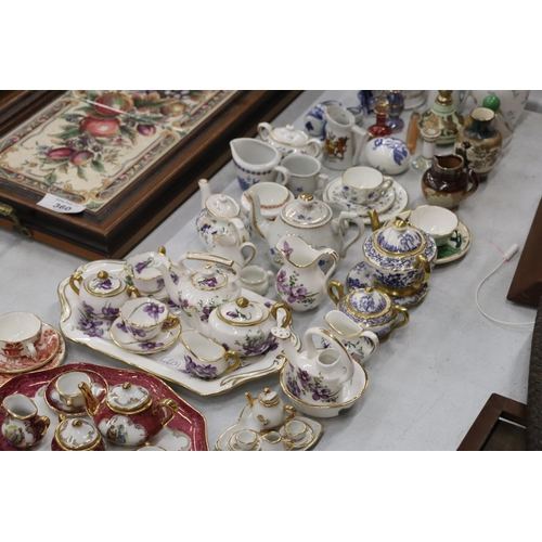 358 - A LARGE COLLECTION OF MINIATURE CHINA AND POTTERY TO INCLUDE LIMOGES AND HAMMERSLEY TEASETS ON TRAYS... 