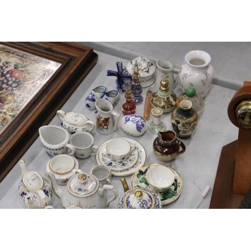 358 - A LARGE COLLECTION OF MINIATURE CHINA AND POTTERY TO INCLUDE LIMOGES AND HAMMERSLEY TEASETS ON TRAYS... 