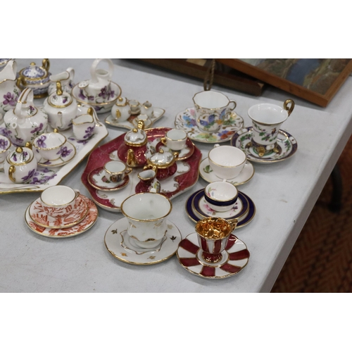 358 - A LARGE COLLECTION OF MINIATURE CHINA AND POTTERY TO INCLUDE LIMOGES AND HAMMERSLEY TEASETS ON TRAYS... 