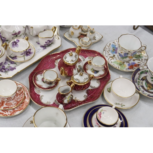 358 - A LARGE COLLECTION OF MINIATURE CHINA AND POTTERY TO INCLUDE LIMOGES AND HAMMERSLEY TEASETS ON TRAYS... 