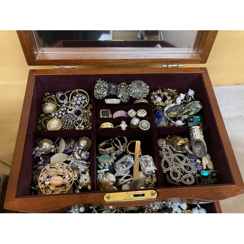 51 - A THREE DRAWER JEWELLERY CHEST WITH HINGED TOP, MIRROR AND COSTUME JEWELLERY CONTENTS