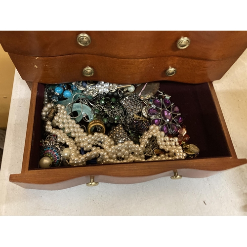 51 - A THREE DRAWER JEWELLERY CHEST WITH HINGED TOP, MIRROR AND COSTUME JEWELLERY CONTENTS