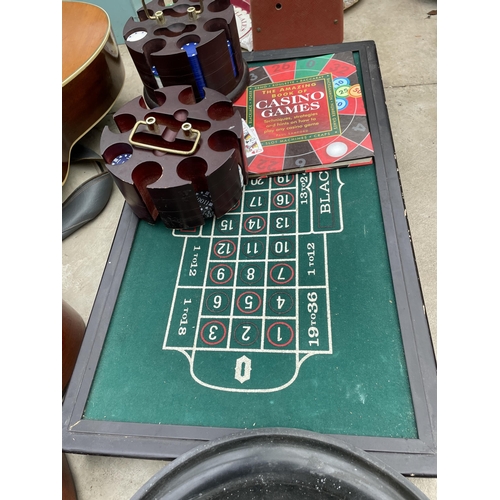 1808 - A ROULETTE GAMES SET TO INCLUDE A TABLE, WHEEL AND CHIPS ETC