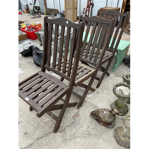 1858 - THREE WOODEN FOLDING GARDEN CHAIRS