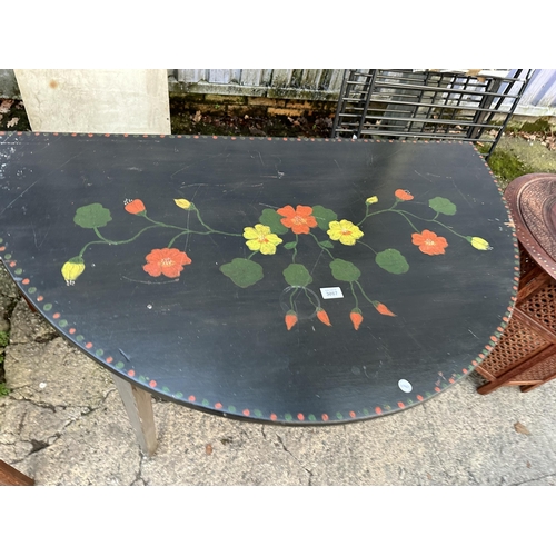 3087 - A FLORAL PAINTED DEMI-LUNE TABLE, 47