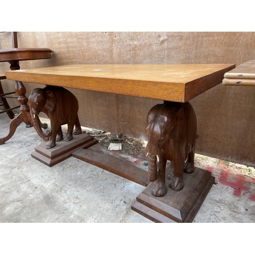 A Retro Teak Coffee Table With Carved Elephant Legs A Bamboo And