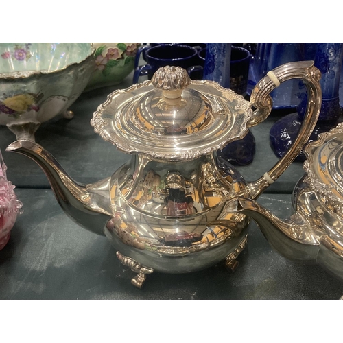 101 - A VINTAGE SILVER PLATED TEASET TO INCLUDE A TEAPOT, COFFEE POT, SUGAR BOWL AND CREAM JUG