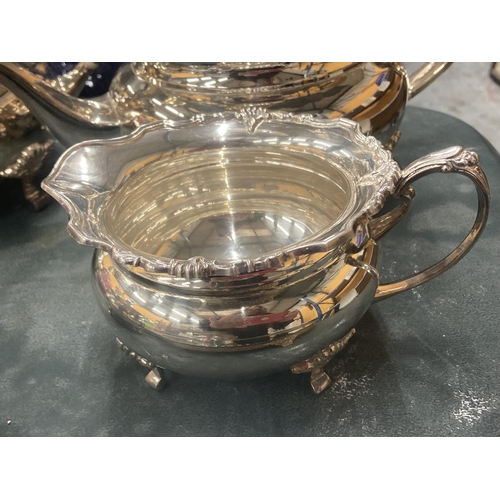 101 - A VINTAGE SILVER PLATED TEASET TO INCLUDE A TEAPOT, COFFEE POT, SUGAR BOWL AND CREAM JUG