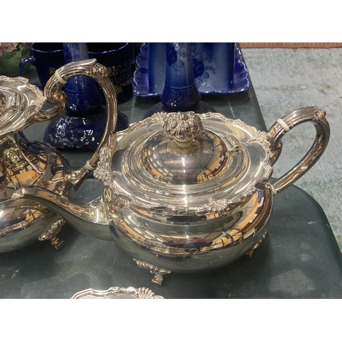 101 - A VINTAGE SILVER PLATED TEASET TO INCLUDE A TEAPOT, COFFEE POT, SUGAR BOWL AND CREAM JUG