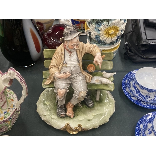 120 - TWO ITALIAN CAPODIMONTE STYLE FIGURES TO INCLUDE AN OLD MAN ON A BENCH FEEDING BIRDS AND A BOY EATIN... 