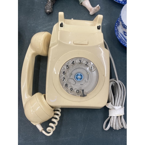 121 - A VINTAGE CREAM ROTARY DIAL TELEPHONE